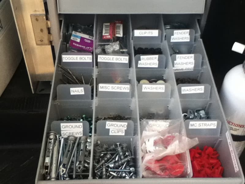 Organized truck drawer of electrical fasteners and supplies